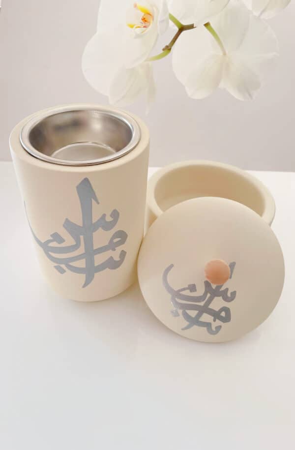Bahrain Pottery, Bakhoor Burner with Arabic design and stainless steel interior to burn oud. The pottery is cream with handprinted Arabic Calligraphy.