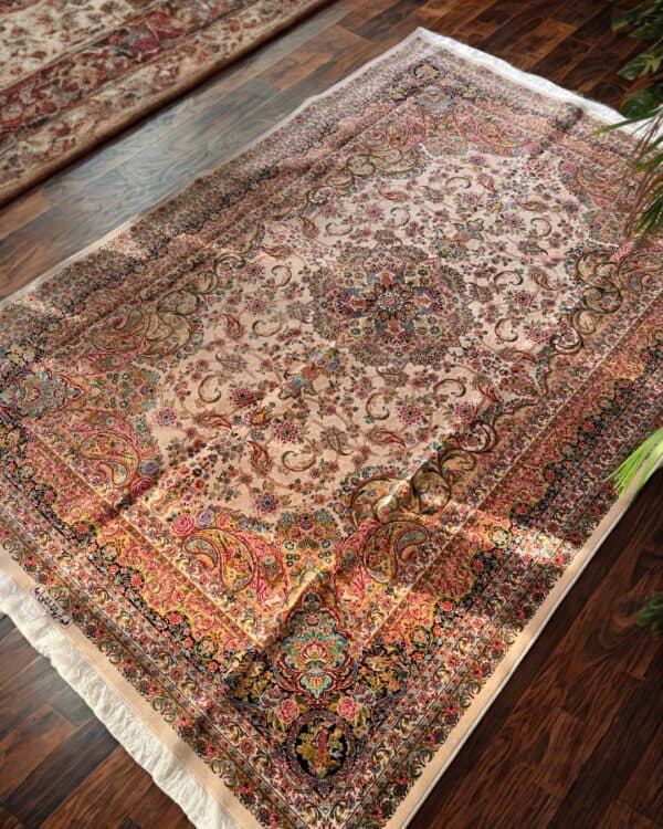 Decorative Silk Persian rug featuring detailed floral motifs and rich colours, perfect for enhancing living room aesthetics.