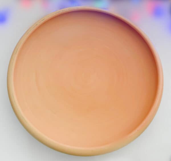 Traditional clay made in Bahrain, this is a round disc and it is a piece of Arabian Art.