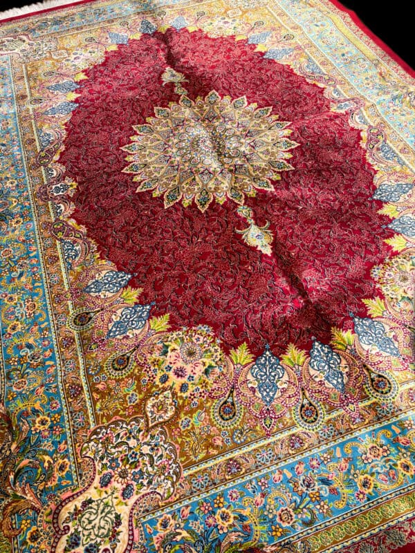 Silk Persian Red rug with intricate patterns and vibrant colours. Perfect for adding a touch of luxury and tradition to any living space.