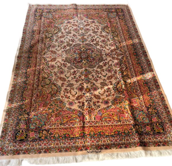 Elegant Silk Persian rug featuring intricate floral designs and vibrant colours.