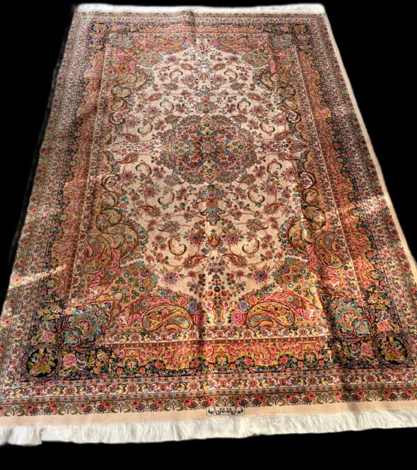 Elegant Silk Persian rug featuring intricate floral and paisley designs in vibrant colours. Perfect for adding a touch of luxury and tradition to any living space.