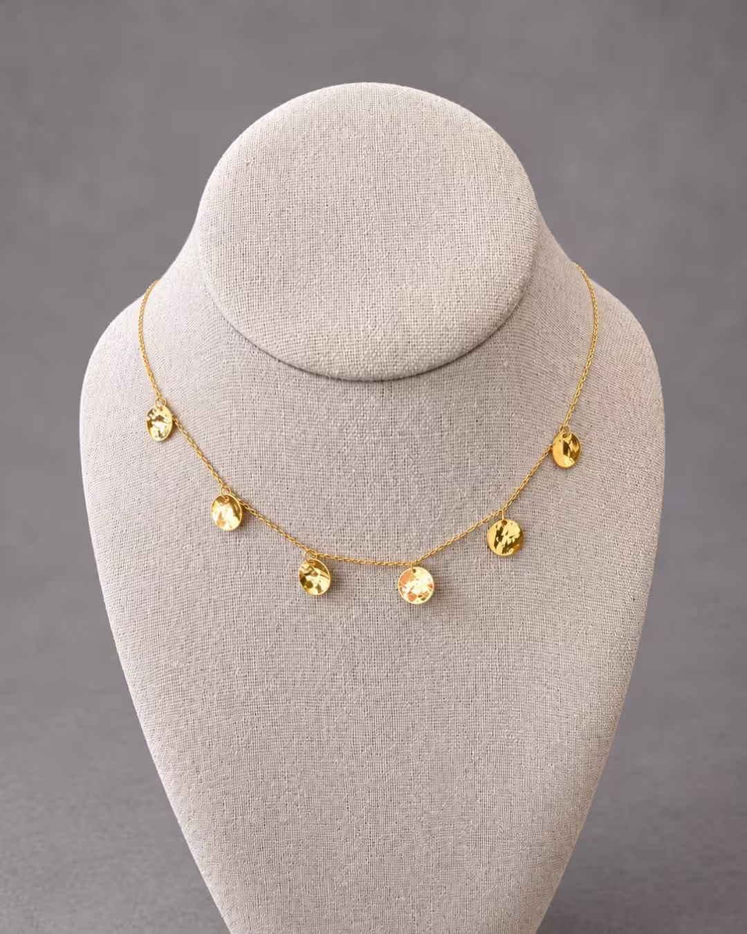 An 18K Gold Hammered Gold Disc Necklace