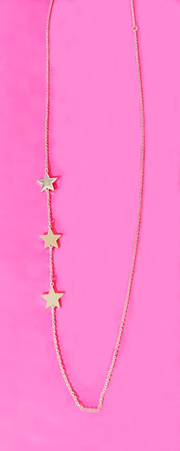 Gold star necklace with three star pendants on a delicate chain, perfect for women and girls. Ideal for everyday wear or special occasions, adding a touch of sparkle to any outfit.