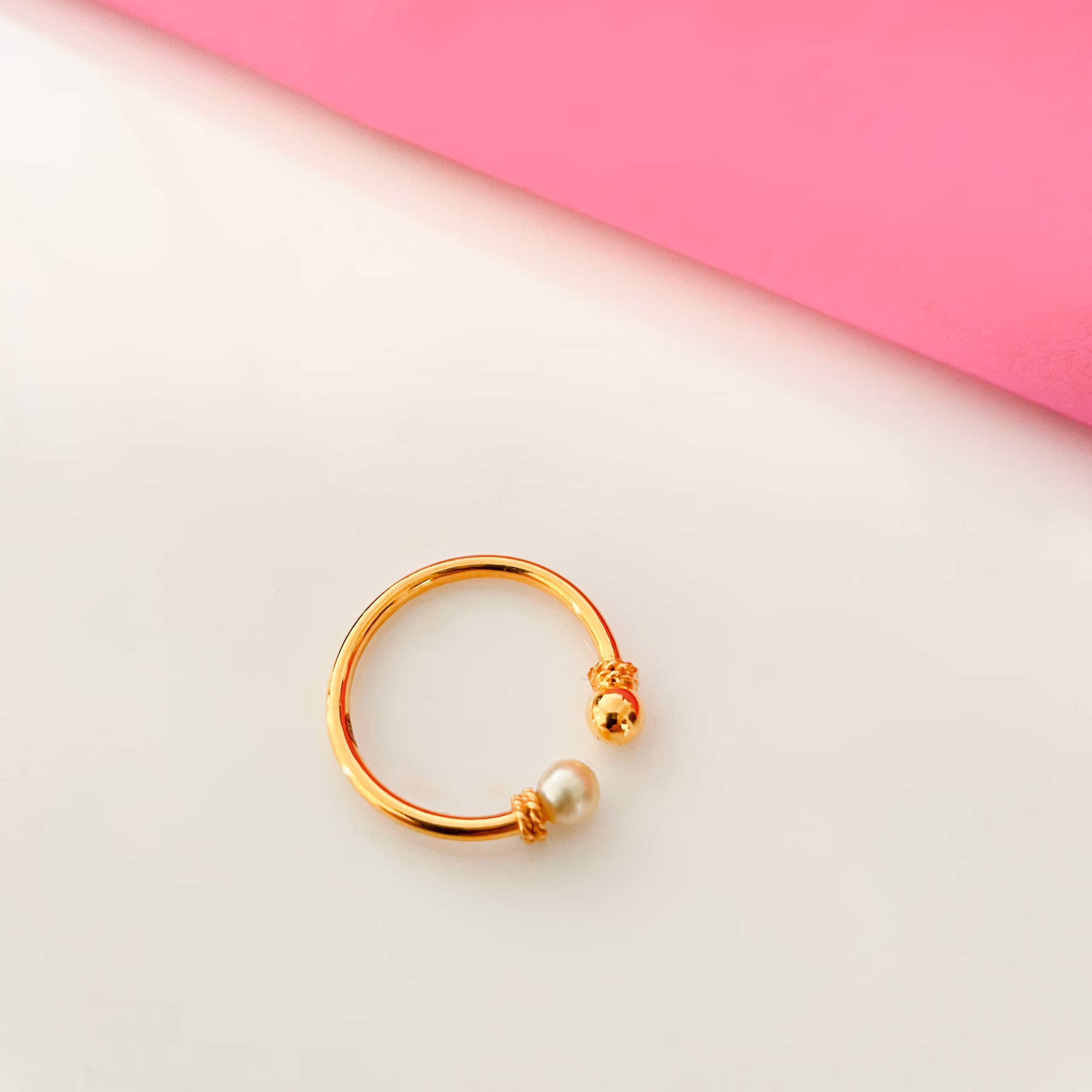 Gold ring with pearl and gold orb