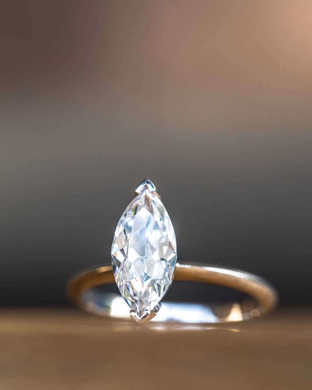 A diamond ring consisting of a large lab diamond set in 18K White gold