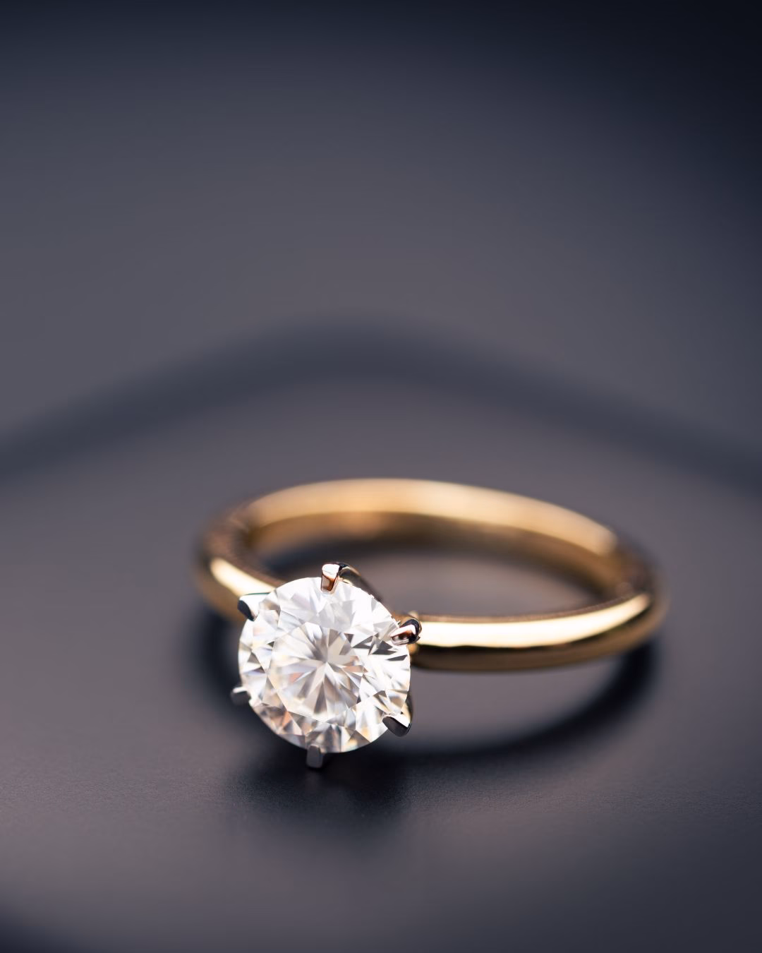A round solitaire lab diamond ring set in 18k gold